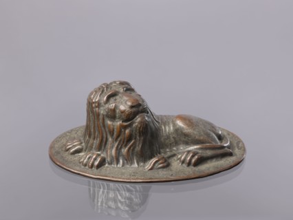 Jelly mold, repoussé copper sheet in the form of a lying lion; raised head allows contents to be