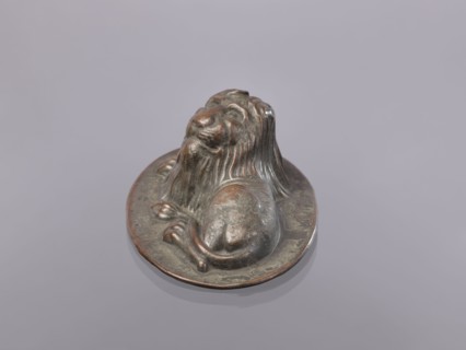 Jelly mold, repoussé copper sheet in the form of a lying lion; raised head allows contents to be