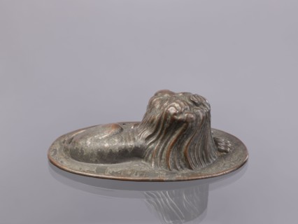 Jelly mold, repoussé copper sheet in the form of a lying lion with raised head allowing contents to