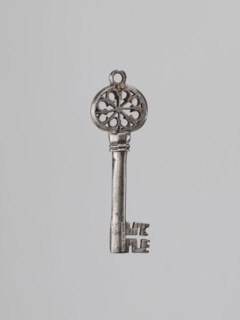 Key, Venetian key; tubular smooth base, blade with a cross-shaped cutout and edge notches. Two