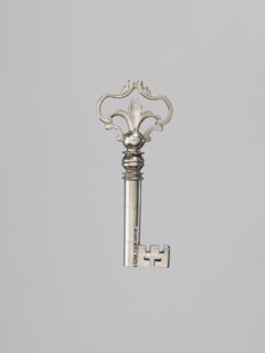 Furniture key, locksmithing; tubular handle with rectangular quill with cutouts. Ball-shaped node