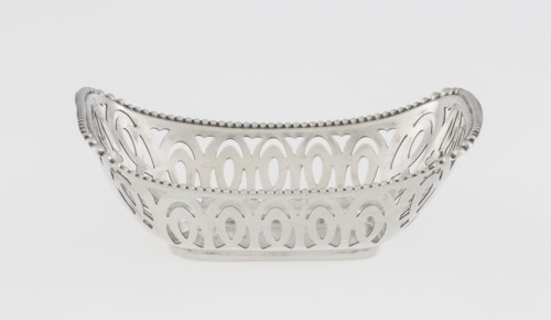 Openwork silver basket, openwork geometric ornaments with pearling; rectangular with raised edge on