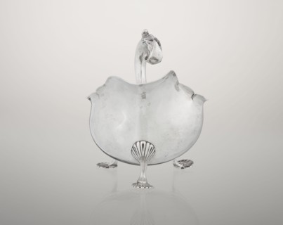 Sauce boat by Henry Matthews fl. 1893–ca. 1930, goldsmith. Hemispherical silver sauce boat with an