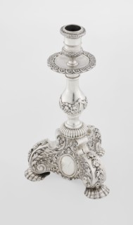 Single-candle candlestick, neo-Baroque style, silver, supported on three shells and a three-sided