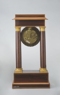 Mantel clock by Alexandre Pertrand fl. ca. 1840. Four-column portico form on a cuboid base and