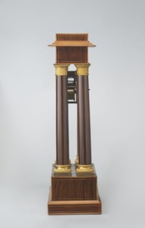 Mantel clock by Alexandre Pertrand fl. ca. 1840. Four-column portico form on a cuboid base and