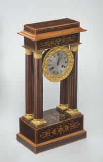Mantel clock by Alexandre Pertrand fl. ca. 1840. Four-column portico form on a cuboid base and