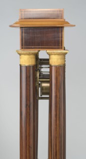 Mantel clock by Alexandre Pertrand fl. ca. 1840. Four-column portico form on a cuboid base and
