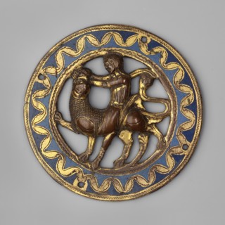 Medallion, Samson Bible, Samson fighting a lion iconography. Circular openwork medallion with an