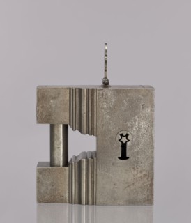 Padlock, 19th century. A cuboid-shaped padlock with the upper part topped by a cornice; on each