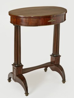 Table, Empire style, columns, floral decoration. Oval-top table with a drawer in the frame,