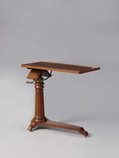 Bedside table, Biedermeier style; mahogany. Composed of an elongated platform outline similar to a