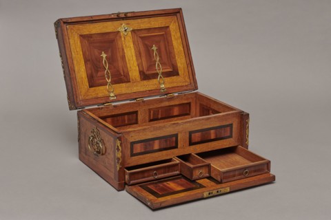 Casket, Repossession noted. Cuboid case inlaid with figural scenes and openwork brass fittings.