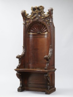 Church throne armchair, carved, with two console supports for the board seat and a high rectangular
