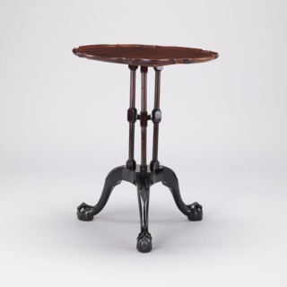 Table, SIDE TABLE with a round top with a wavy, profiled rim, supported by a shaft composed of