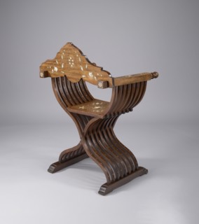 Scissor chair, Scissor armchair made of eight pairs of crossed S-shaped slats, connected at the