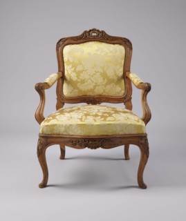 Armchair, rococo style, carved and upholstered seat, backrest and armrests, on four cabriole legs