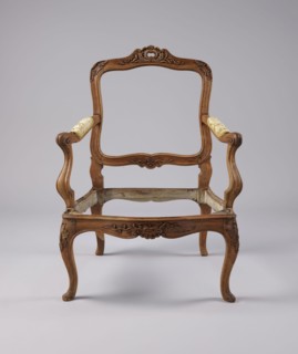 Armchair, rococo style, carved and upholstered seat, backrest and armrests, on four cabriole legs