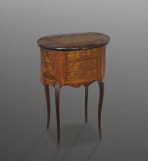 Chest of drawers table, classicism and rococo styles, floral decorations. Oval chest with a tall