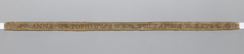 Gallon, galloons haberdashery; woven inscription: brown letters on a silver background; parallel to