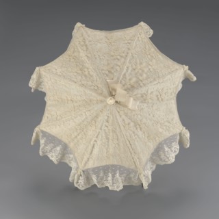 Umbrella, women's umbrella made of white lace. Canopy trimmed with cream silk at the bottom,