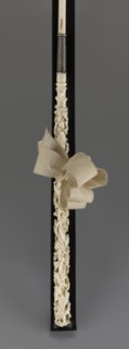Women's umbrella made of white lace. Its canopy is trimmed with cream silk at the bottom, which