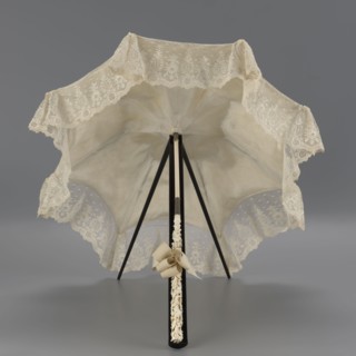 Umbrella, women's umbrella made of white lace. Canopy trimmed with cream silk at the bottom,