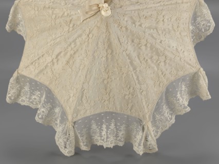 Umbrella. Women's umbrella made of white lace; canopy trimmed with cream silk at the bottom,