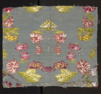 Fabric fragment. Silk brocaded with a symmetrical composition of branches of various stylized