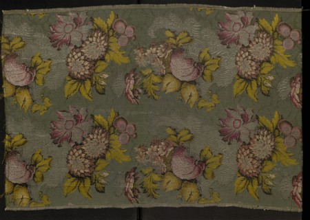 Fragment of patterned silk fabric, 18th century, France. Plant and floral-and-fruit design in a