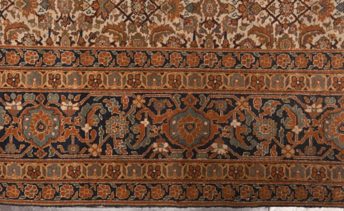 Carpet, 19th century, Iran. Knotted wool carpet with decorative herat-style pattern. Central field