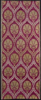 Fabric with a motif of pointed ovals formed from wide ribbons decorated with floral tendrils.