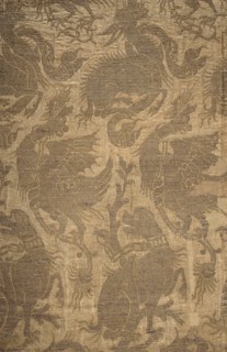 Fabric fragment, patterned silk brocaded with gold Cypriot thread on pale pink ground. The brocaded