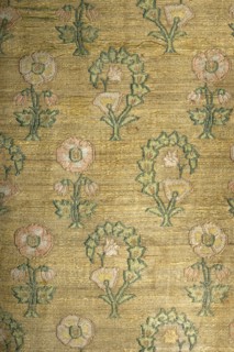 Tapestry, sewn from two fabrics. Rectangular central field of silk ikat fabric, interwoven with