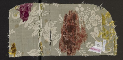 Fabric fragment, 18th-century silk fabric, France. White grosgrain background, pattern displayed