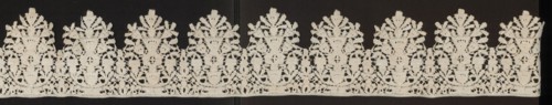 Lace fragment, Floral ornaments; lower edge serrated. In each oval there is a vase of flowers.