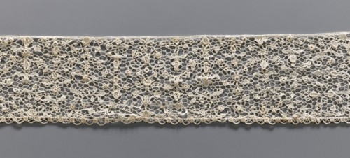 Lace fragment, lace with a fine floral pattern; de brides background with picots; lower edge with