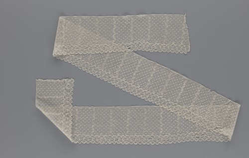 Lace fragment, a strip with a serrated edge on one side and an edge-type ornament on the serrated