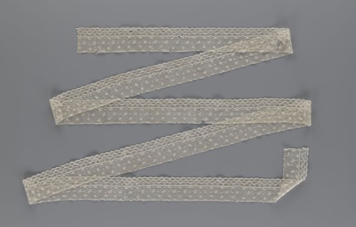 Lace fragment, edge ornament on one side — a net with numerous loops small, round and slightly