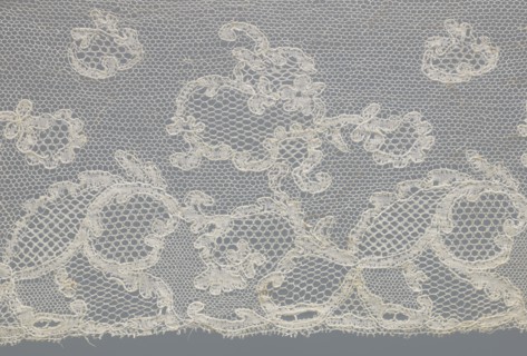 Fragment of lace, lace. Inside the motifs there are varied mesh backgrounds: drochel, ißsgrond, and