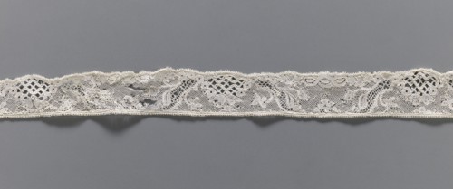 Lace fragment, floral ornaments, Malines lace, pattern with motifs of winding ribbons, flowers, and