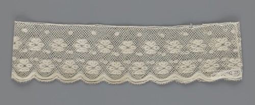 Fragment of lace, lace, a section of a belt sewn into a closed circle with one-sided arched