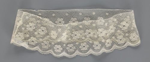 Fragment of lace, lace. A section of a belt sewn into a closed circle with one-sided arched