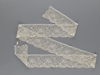 Lace fragment, lace, floral ornaments with rocaille motifs, over-stylized fan-shaped ribbons with