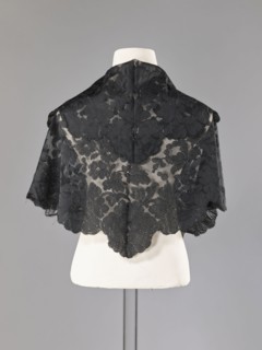 Cape, capes, fashion, women's clothing. Cape in the form of an elongated rhombus, made of black