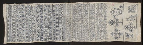 Embroidery sampler, Sampler with a cross-stitch pattern with motifs of trails, flower bushes, and