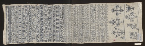 Embroidery sampler, Sampler with a cross-stitch pattern of trails, flower bushes, and letters. Blue