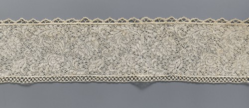 Fragment of bobbin lace with plant ornaments, 18th century, Flanders;, width 7 cm, length 74 cm., A