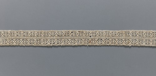 Fragment of needle lace, 16th–17th century, Flanders; width 2.8 cm, length 55 cm; provenance: