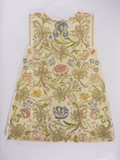 Two fragments of a dalmatic, front and back, of silk fabric interwoven with silver thread.